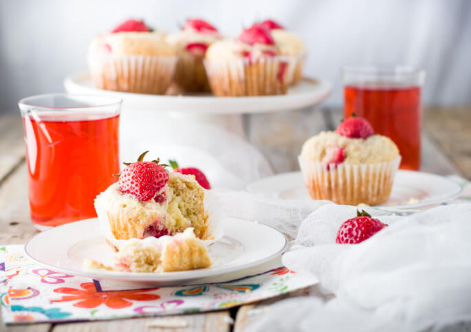 Soft and tender, playful and joyful, quick and easy strawberry coconut muffins. The perfect way to start your day or enjoy all day long. Light on sugar, filled with a delicious combination of sweet strawberries and shredded coconut! 