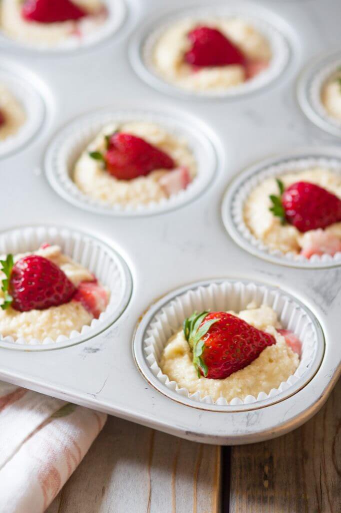 Soft and tender, playful and joyful, quick and easy strawberry coconut muffins. The perfect way to start your day or enjoy all day long. Light on sugar, filled with a delicious combination of sweet strawberries and shredded coconut! 