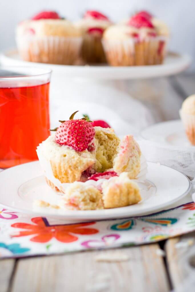 Soft and tender, playful and joyful, quick and easy strawberry coconut muffins. The perfect way to start your day or enjoy all day long. Light on sugar, filled with a delicious combination of sweet strawberries and shredded coconut!