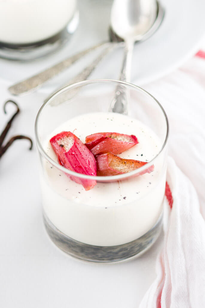 Vanilla panna cotta with roasted rhubarb is an elegant, refreshing, quick & easy dessert. Ideal for summer. Luxurious, remarkable creamy, melt in your mouth panna cotta paired with the sweet and sour roasted rhubarb is a PURE PLEASURE.