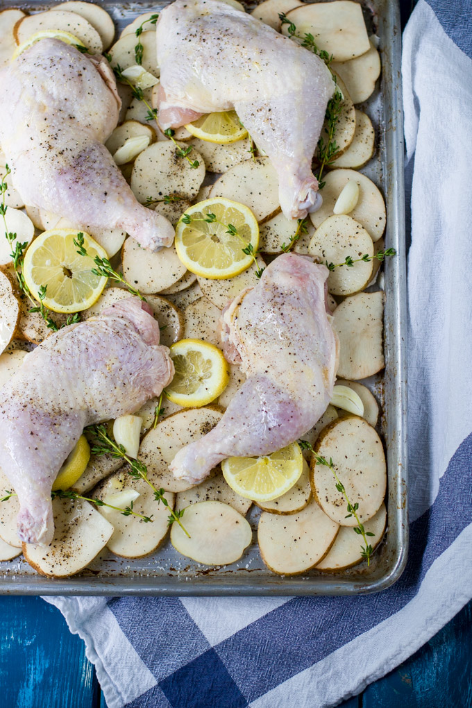 Roasted chicken legs with lemon and potatoes recipe. Thyme and lemon brings a lot of fresh aroma and taste into this simple, delicious dish. For busy rough days just add a glass of wine and enjoy this rustic comfort dinner to the fullest. Bon Apetit!