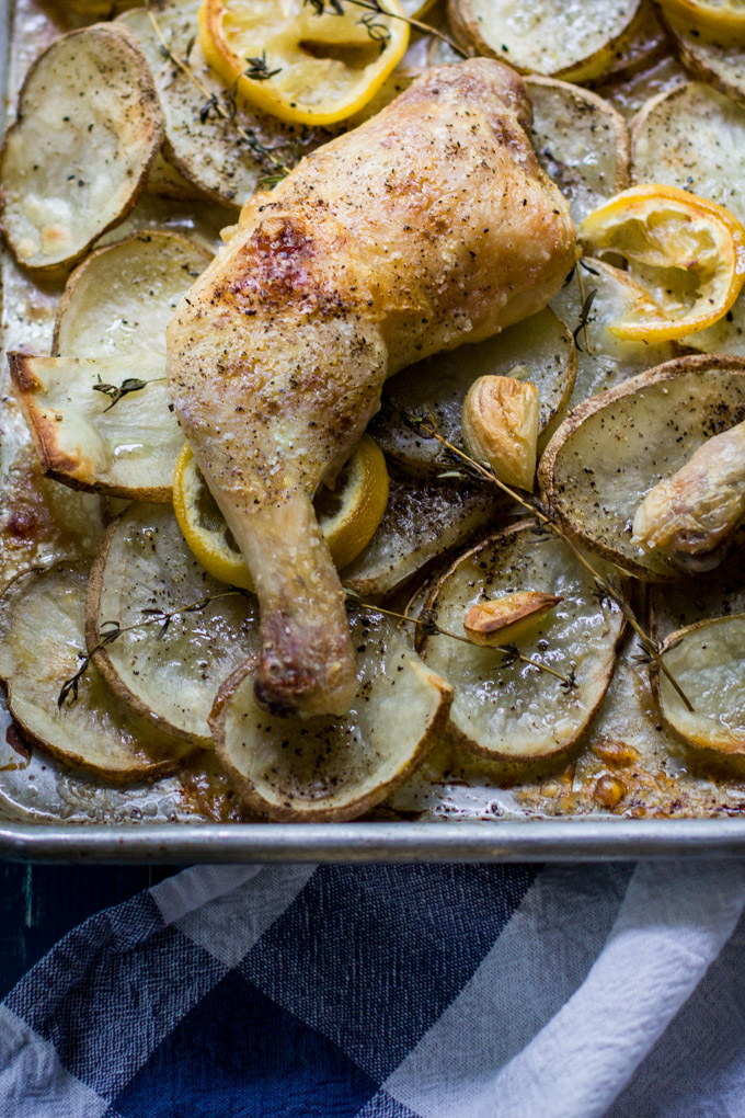 Roasted chicken legs with lemon and potatoes recipe. Thyme and lemon brings a lot of fresh aroma and taste into this simple, delicious dish. For busy rough days just add a glass of wine and enjoy this rustic comfort dinner to the fullest. Bon Apetit!