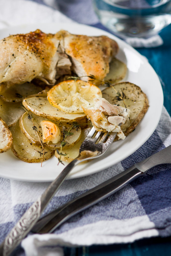 Roasted chicken legs with lemon and potatoes recipe. Thyme and lemon brings a lot of fresh aroma and taste into this simple, delicious dish. For busy rough days just add a glass of wine and enjoy this rustic comfort dinner to the fullest. Bon Apetit!