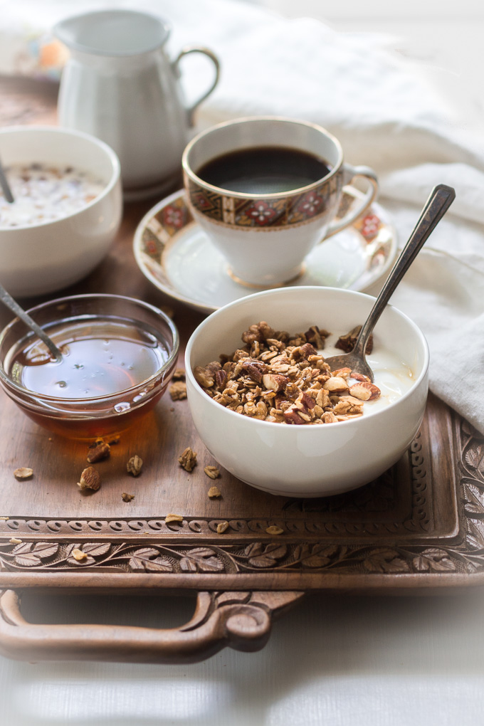 Homemade coffee granola with winter spices is the perfect way to start your day. This granola is like eating a slice of a gingerbread with the cup of freshly brewed coffee, but a lot healthier.