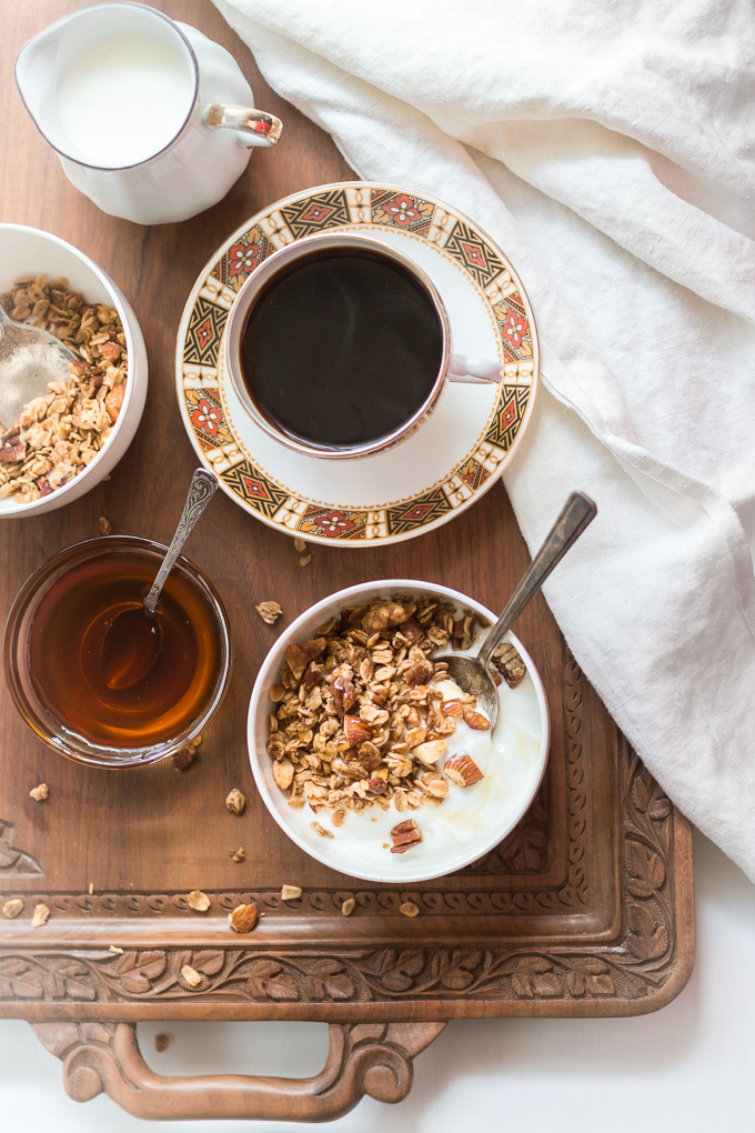 Homemade coffee granola with winter spices is the perfect way to start your day. This granola is like eating a slice of a gingerbread with the cup of freshly brewed coffee, but a lot healthier.