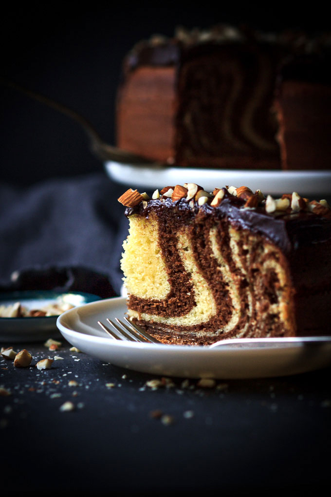 A very simple, yet sophisticated Zebra cake with chocolate glazing recipe. With very little efforts, in 1 ½ hours, you will get the airy textured cake with vanilla, and chocolate aroma and melt in your mouth chocolate glazing.
