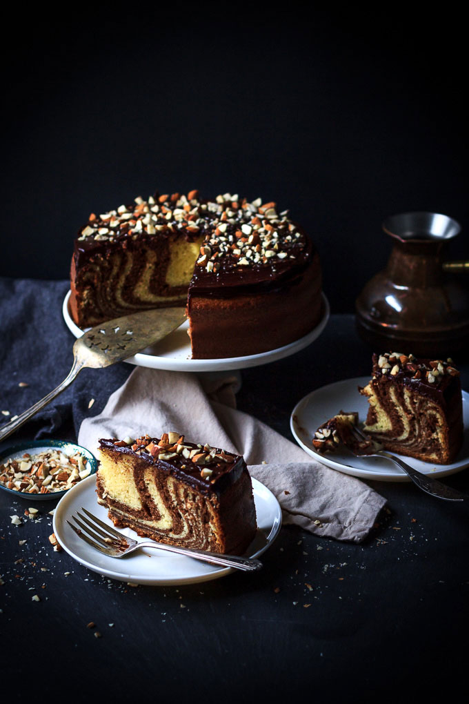 A very simple, yet sophisticated Zebra cake with chocolate glazing recipe. With very little efforts, in 1 ½ hours, you will get the airy textured cake with vanilla, and chocolate aroma and melt in your mouth chocolate glazing.