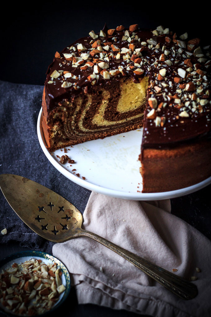 A very simple, yet sophisticated Zebra cake with chocolate glazing recipe. With very little efforts, in 1 ½ hours, you will get the airy textured cake with vanilla, and chocolate aroma and melt in your mouth chocolate glazing.