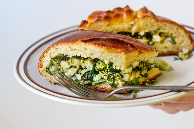 This Ukrainian savory egg and fresh herbs pie is a family recipe and one of my favorite pies from the childhood. The combination of fresh eggs from a local farm and fragrant seasonal dill, parsley and scallions wrapped in a soft, lightly sweetened yeasted dough will make you fall in love with this recipe.