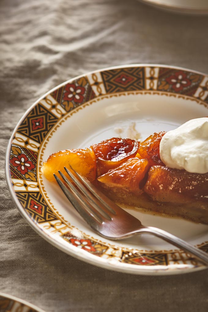 This Classic French Apple Tarte Tatin recipe is a pure pleasure to enjoy during apple season. Despite the scary name it is very easy to make, requires only one pan, simple ingredients and a tiny portion of your day. Enjoy this golden caramelized treat with the fragrant vanilla bean ice cream. #apple #tartetatin #appledessert