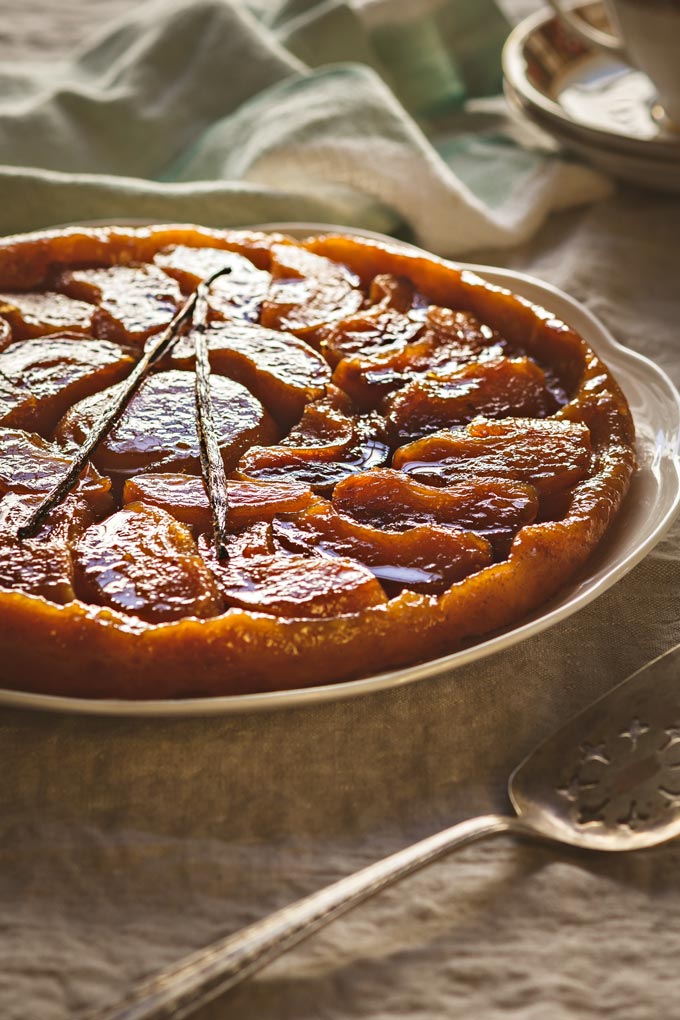 This Classic French Apple Tarte Tatin recipe is a pure pleasure to enjoy during apple season. Despite the scary name it is very easy to make, requires only one pan, simple ingredients and a tiny portion of your day. Enjoy this golden caramelized treat with the fragrant vanilla bean ice cream. #apple #tartetatin #appledessert