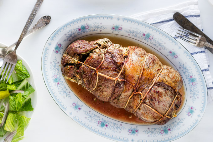This fresh herbs and feta cheese stuffed leg of lamb recipe is a stunning way to impress your guests. Prep the lamb a day ahead so it will absorb all the aromas from the filling. Cook it the next day and enjoy it with friends and family. A go-to recipe for a stunning meat main dish for any special occasion.