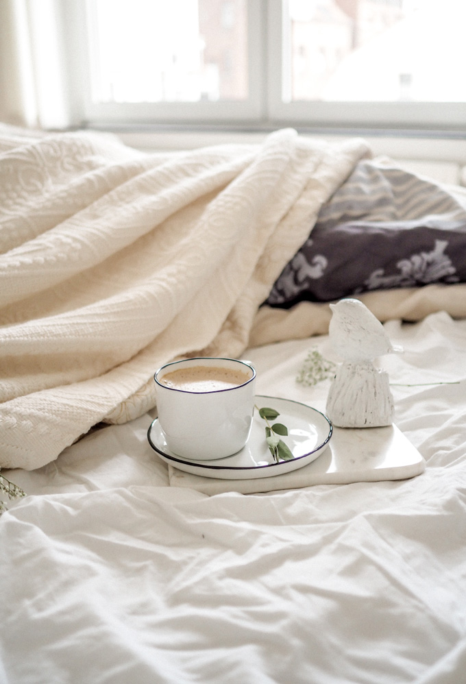 Coffee in bed on a cozy morning. This picture is a part of Weekend Planner Things To Do and Thoughts To Share post from The Pure Taste Blog. 
