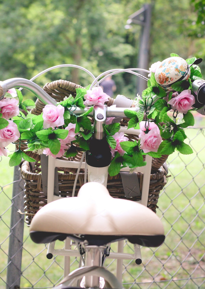 Cute bicycle with flowers in the basket. This picture is a part of Weekend Planner Things To Do post from The Pure Taste Blog. Weekend planner things to do and thoughts to share is a post where I share my weekly highlights. I hope you will find here some inspiration and new ideas how to spend your weekend, day-off or a date night. I also share some useful information to make our lives better, healthier and filled with fun and happiness. #weekend #weekendplanner #dayoff