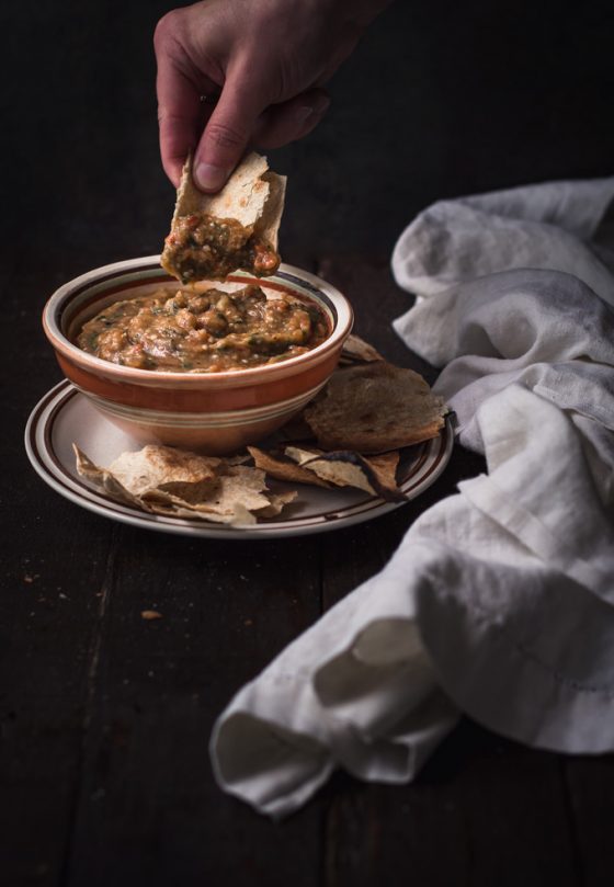 This roasted eggplant dip recipe is our favorite way to use seasonal eggplants. A family recipe called eggplant caviar - Ukrainian and Russian authentic food. Roasted eggplant with a smoky hint combined with fresh raw vegetables makes an irresistible dip or eggplant spread, depends on how you like to eat it. On top of that, this is 100% healthy and vegan eggplant dip! #eggplant #dip #spread #eggplantrecipes